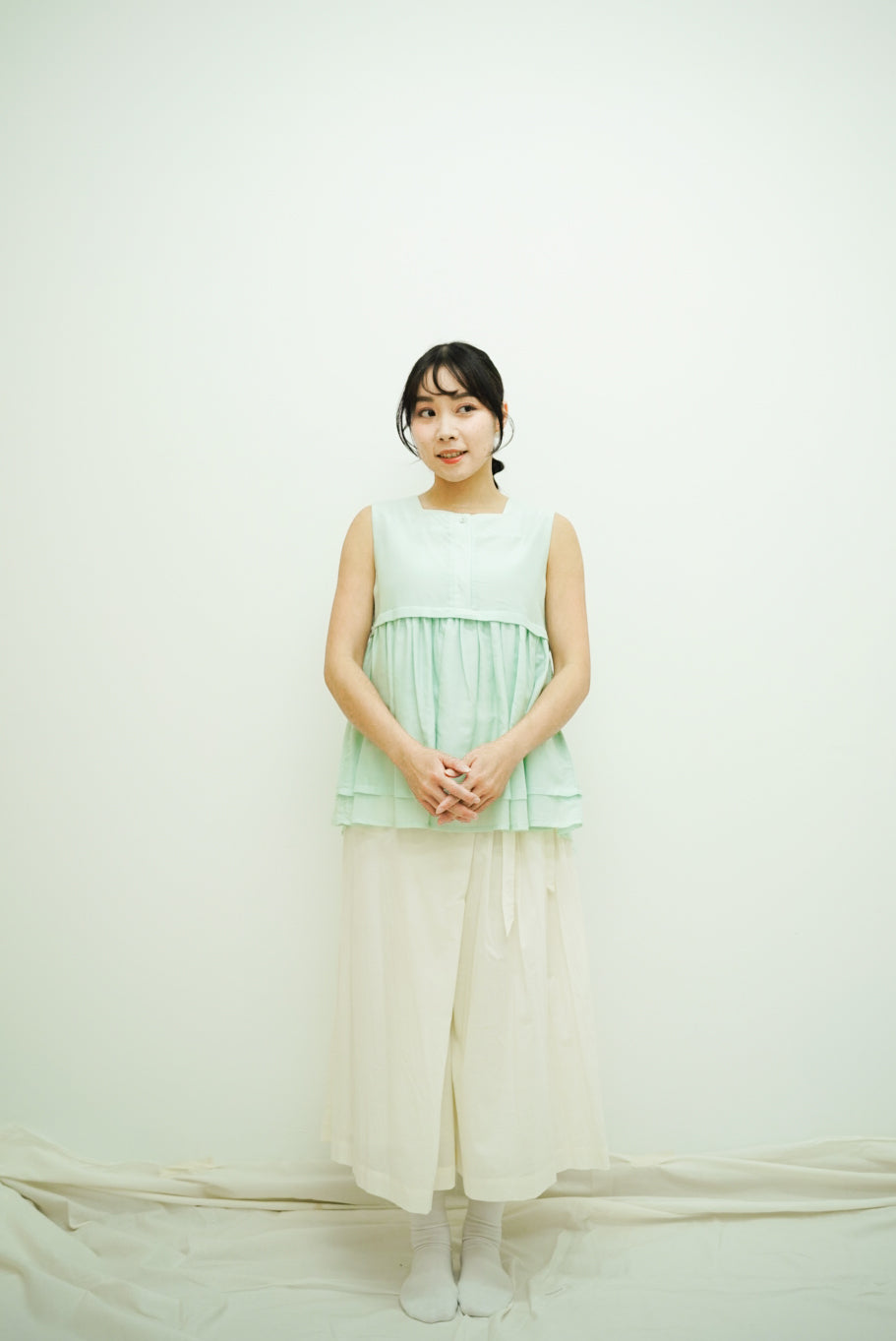 Norellie Vest (light greenish blue)