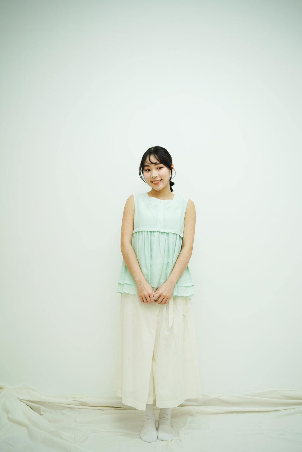 Norellie Vest (light greenish blue)